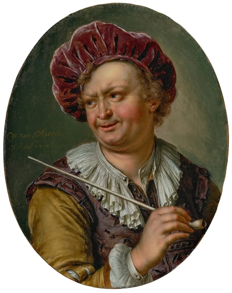 A Man Holding A Pipe