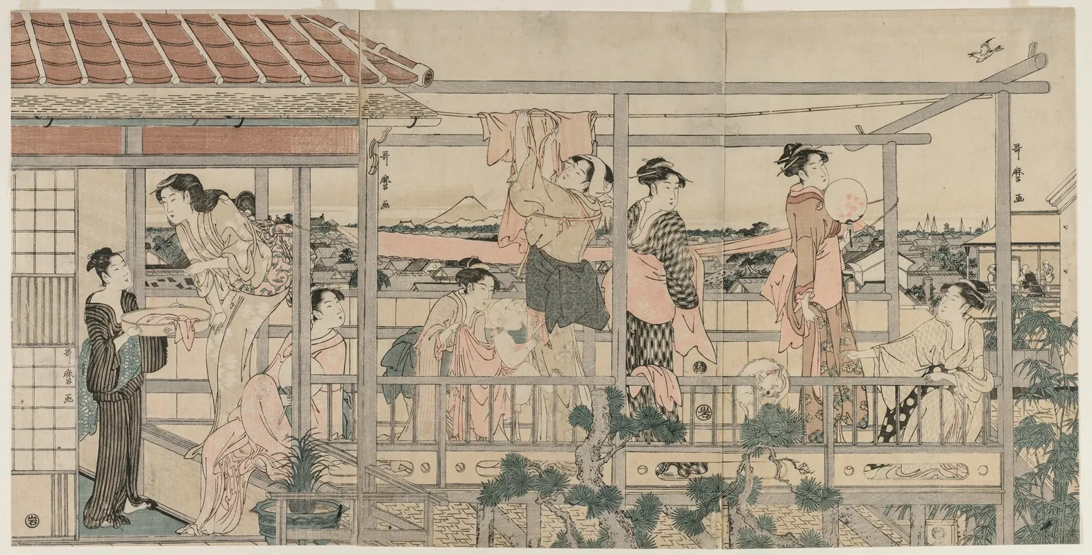 Women Hanging Laundry To Dry On A Balcony