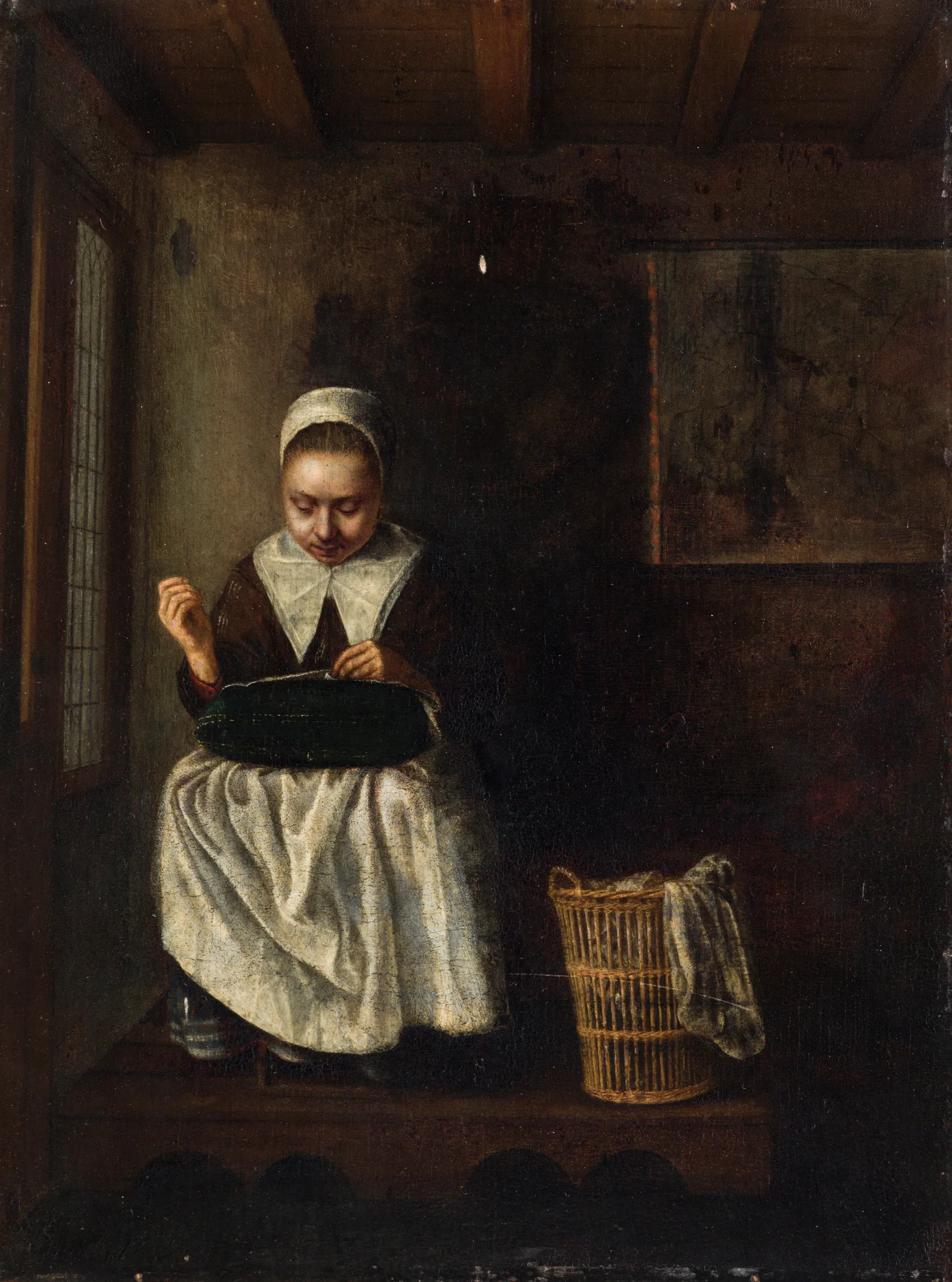 A Girl Sewing Wall Art by Nicolaes Maes - Canvas Print