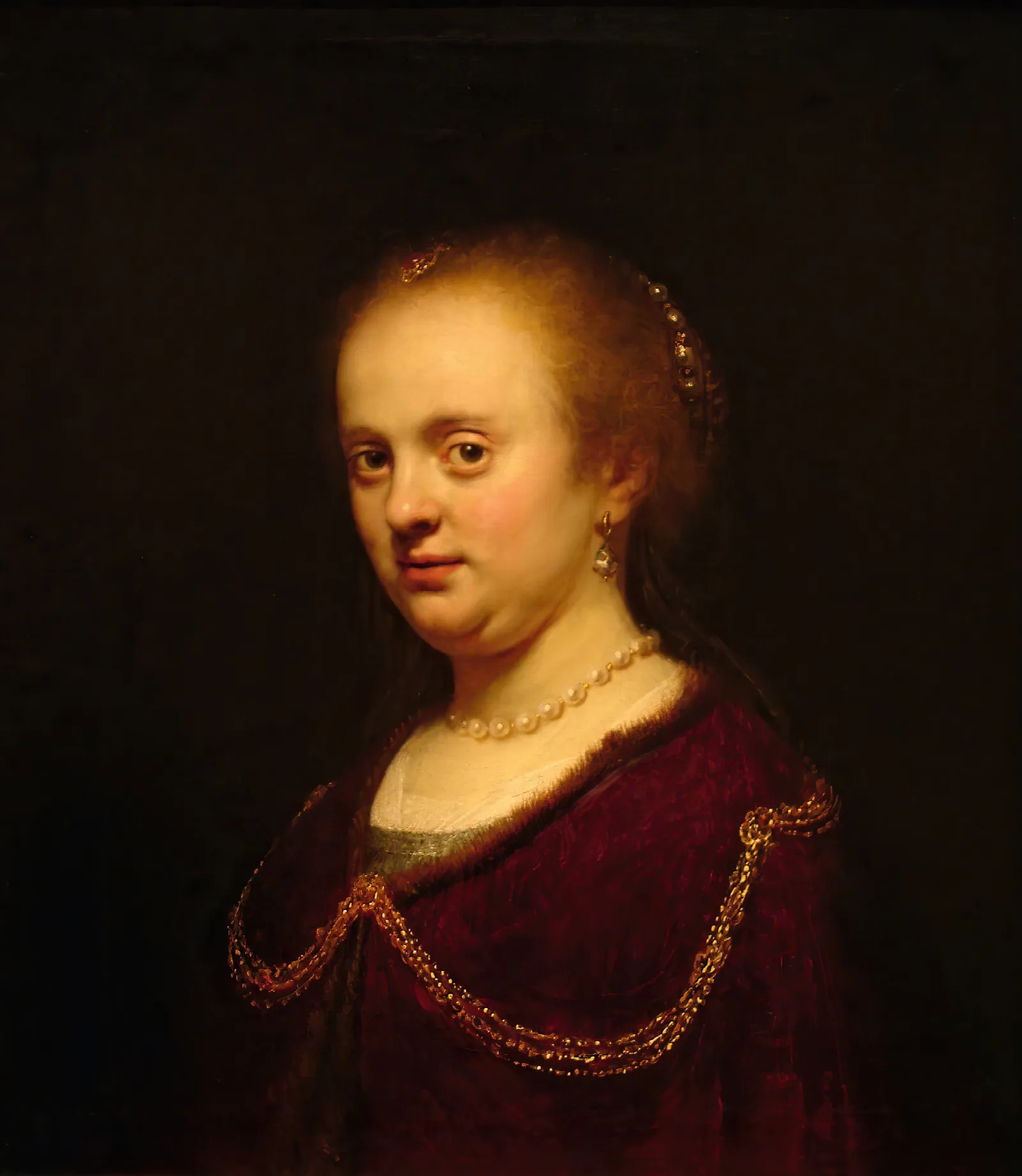 Young Woman With A Gold Chain Wall Art by Rembrandt van Rijn - Canvas Print