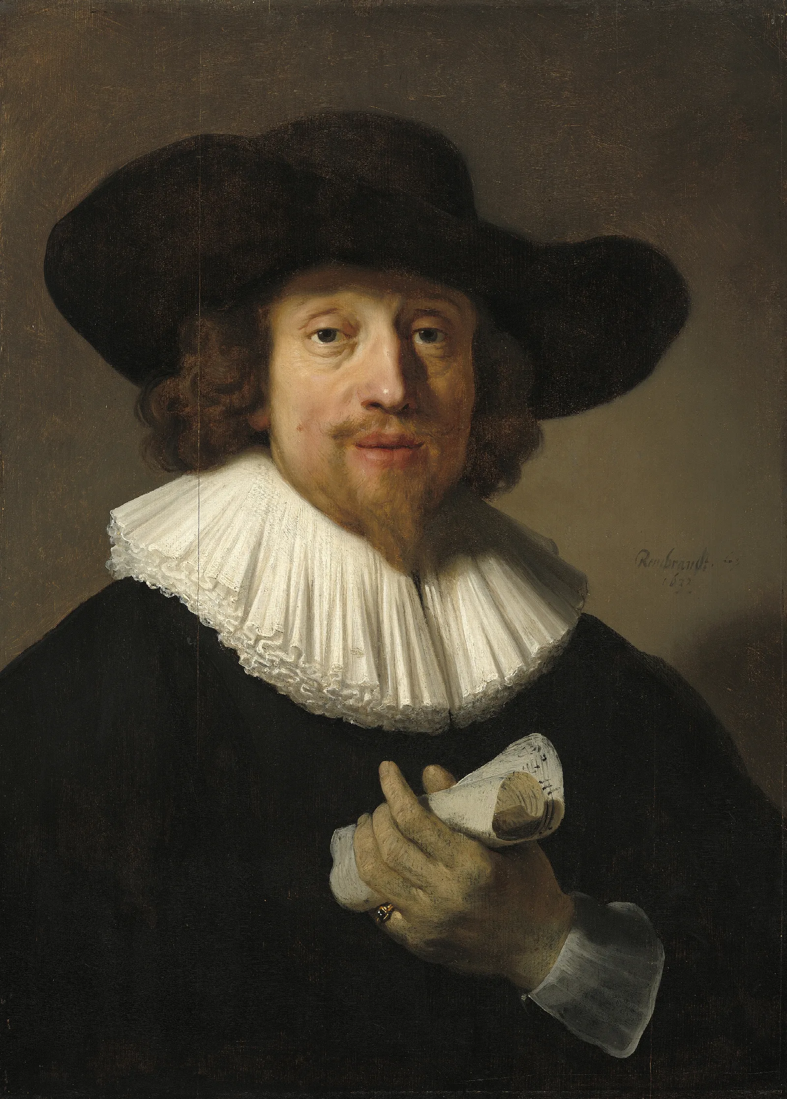 Man With A Sheet Of Music Wall Art by Rembrandt van Rijn - Canvas Print