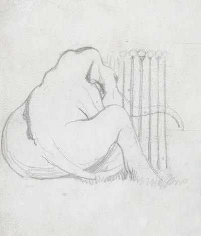 A Baby Elephant Sitting By A Fence