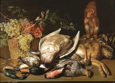 A Basket Of Red And Green Grapes A Goldfinch Game And A Squirrel On A Wooden Table