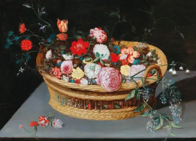 A Basket With Spring Flowers On A Stone Table
