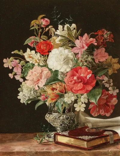 A Bouquet Of Flowers With Camellias In A Silver Vase