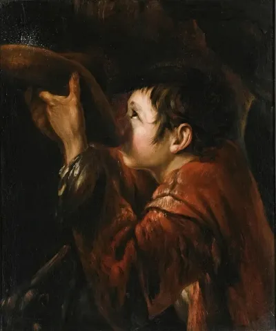 A Boy Using His Hat To Drink Water From A Fountain