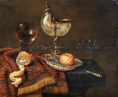 A Clementine In A Porcelain Bowl A Nautilus Cup A Roemer Two Glasses A Knife A Peeled Lemon On An Ornamental Carpet On A Table