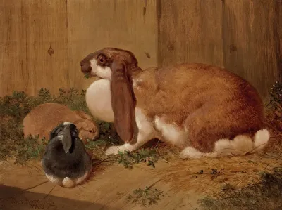 A Lop Eared Doe Rabbit And Her Young