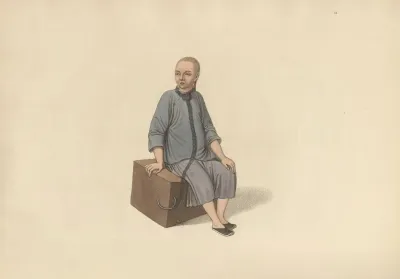 A Man Fastened To A Large Block Of Wood