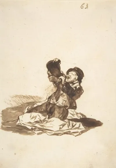 A Man On The Ground Drinking From A Wine Skin
