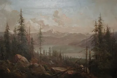 A Mountain Landscape With A Fallen Tree In The Foreground