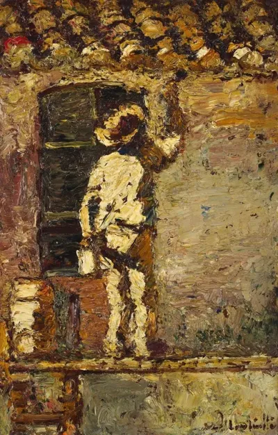 A Painter At Work On A House Wall