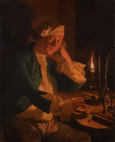 A Scientist Seated At A Desk By Candlelight