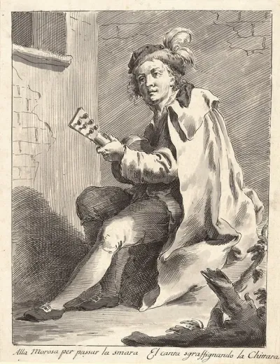 A Seated Man Playing A Guitar