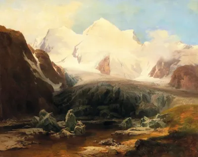 A View Of A Mountain Lake With Snow Capped Mountains In The Background
