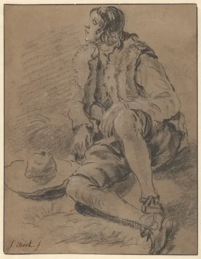 A Young Man Seated On The Ground