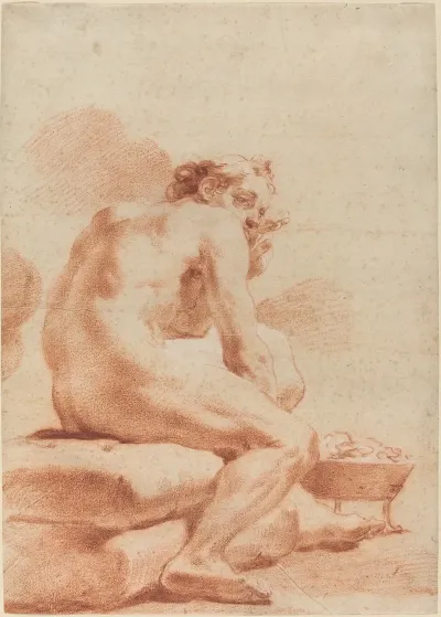 A Young Man Warming Himself At A Brazier