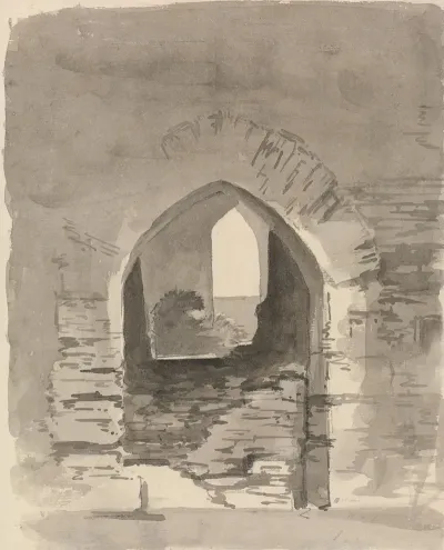 An Arched Entrance Into A Ruined Building