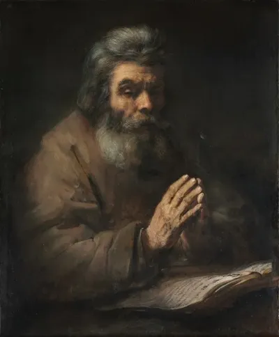 An Elderly Man In Prayer