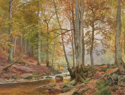 Autumn Woodland With Bridge Over A Stream