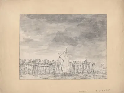 Boat Moored On A Beach By A Wooden Palisade