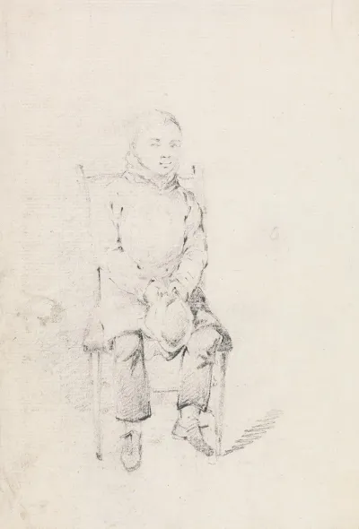 Boy Sitting Holding A Cap