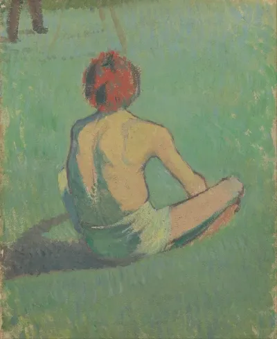 Boy Sitting In The Grass