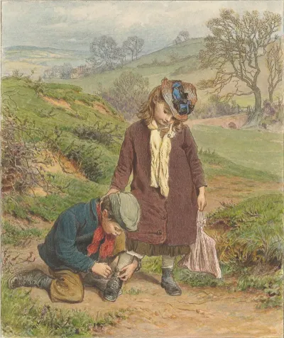 Boy Tying A Girls Shoe