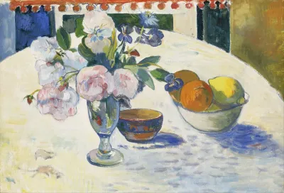 Flowers And A Bowl Of Fruit On A Table