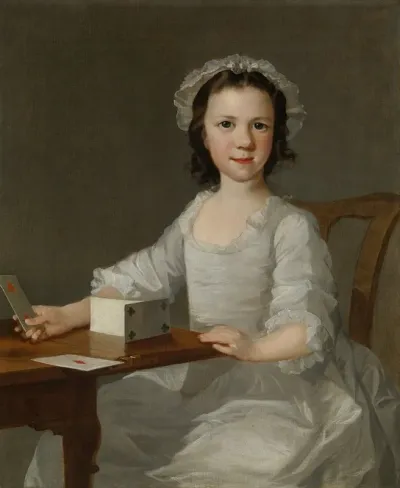 Girl Building A House Of Cards