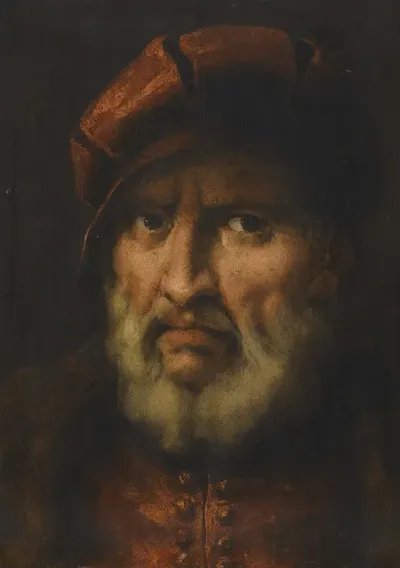 Head Of A Bearded Man Wearing A Red Cap And Red Shirt