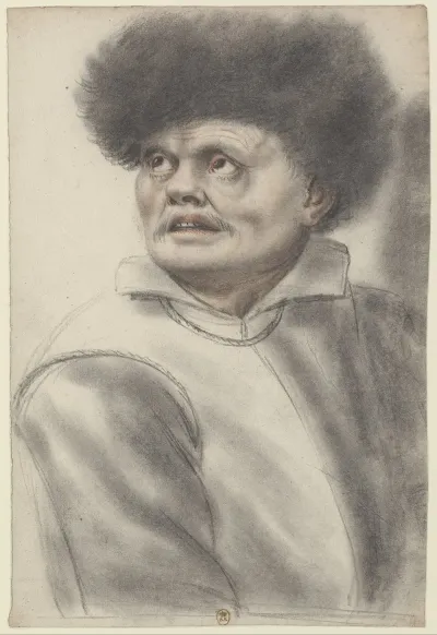 Homme Coiffe Dun Bonnet De Fourrure Les Yeux Leves Vers Le Ciel Vu De Trois Quarts A Gauche