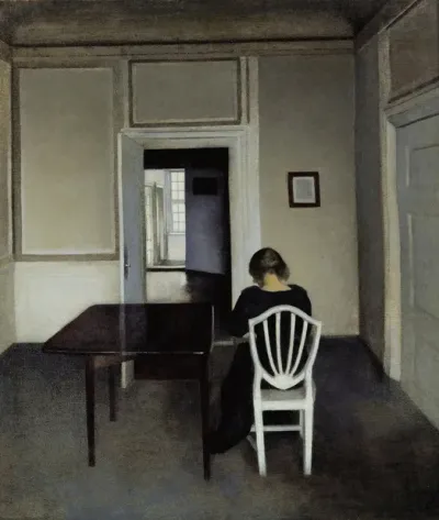 Interior With Ida In A White Chair