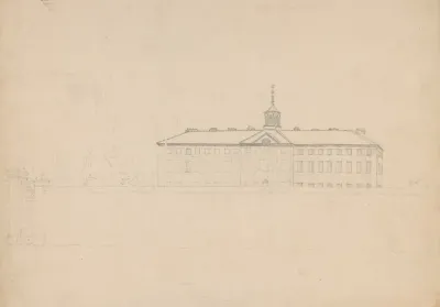Large Building With A Cupola Behind A High Wall