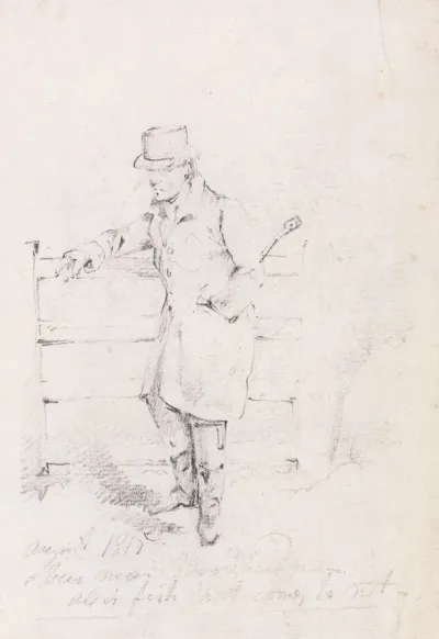 Man Leaning On A Fence