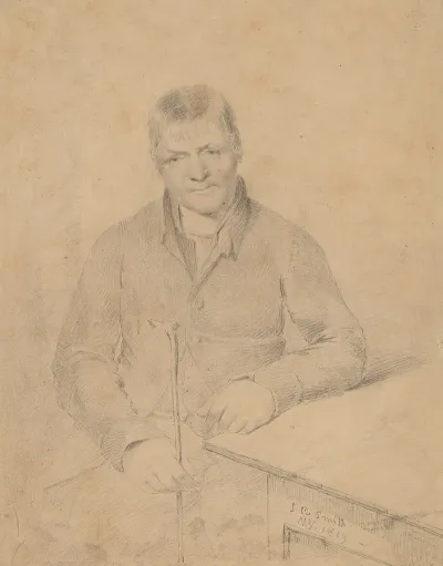 Man Seated At A Table