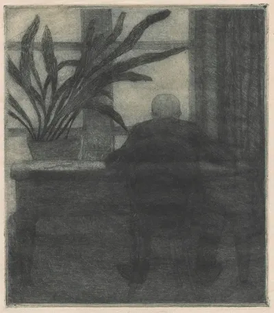 Man Sitting At A Desk