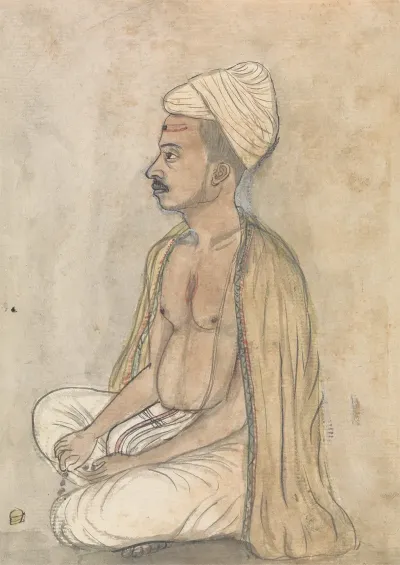 Man With A Yellow Shawl Sitting Crosslegged