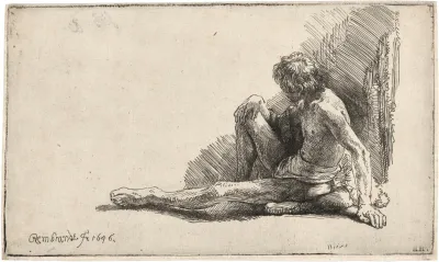 Nude Man Seated On The Ground With One Leg Extended