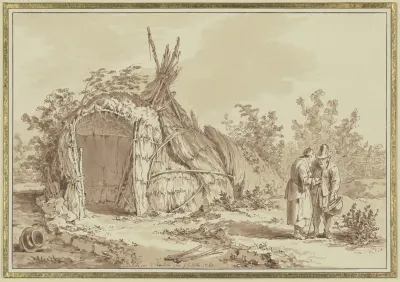 Old Couple In Front Of Straw Hut