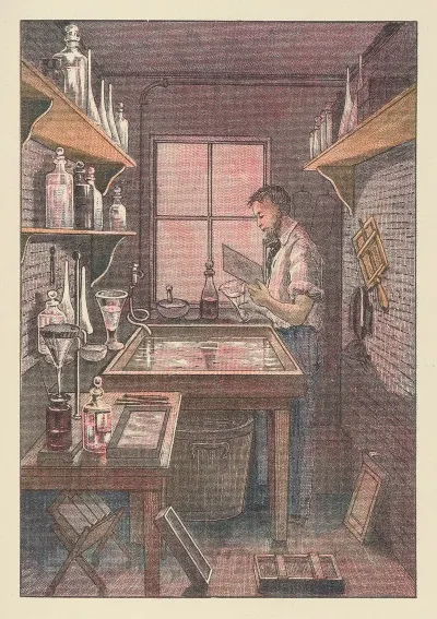 Photographer At Work In A Room Lighted Through A Window Of Red Glass