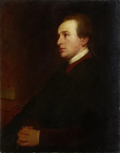 Portrait Of A Young Man At His Desk
