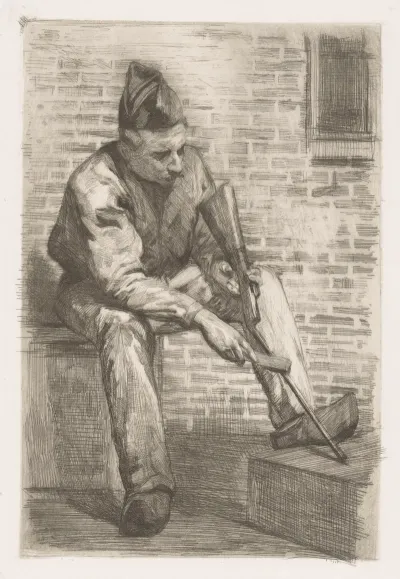 Soldier Cleaning His Rifle