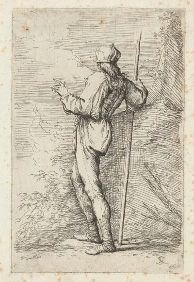 Soldier Standing Holding A Long Cane Before A Rocky Wall