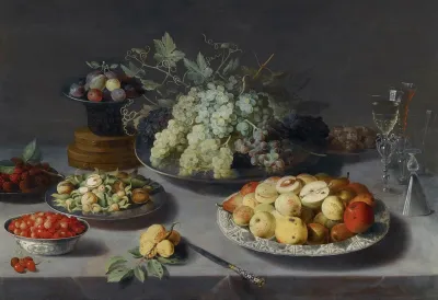 Still Life Of Grapes And Other Fruits With A Knife Facon De Venise Wineglasses And Other Objects On A Draped Table