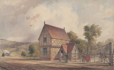 Tudor Style Rural Train Station And Railroad Crossing