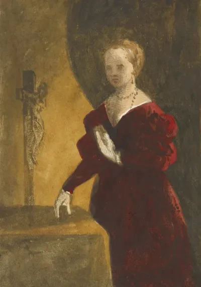 Woman In Deep Red Dress Holding A Book To Her Chest Standing Next To A Table Behind Which Is A Crucifix