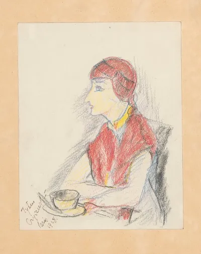 Woman Sitting In A Paris Cafe