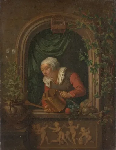 Woman Watering A Plant