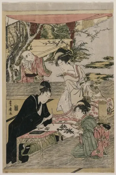 Young Man Writing At A Table